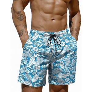 COOFANDY Mens Swim Trunks 7 inch Bathing Suit with Mesh Liner Swim Shorts | Quick Dry Fabric, Lightweight Stretch Material, Breathable Mesh Brief Liner, Swimming, Summer Beach Vacation, Mens Swimwear(White Flowers Leaves on Blue)